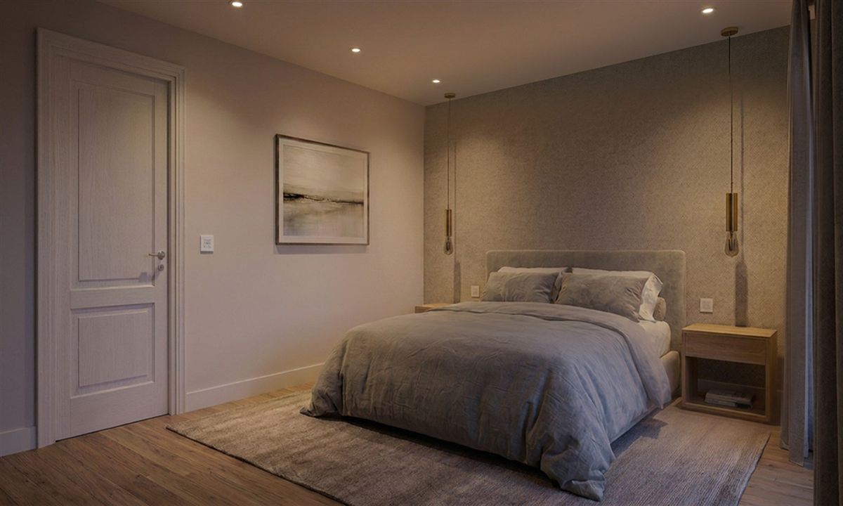 A warm-dimmed bedroom with ceiling downlights and bedside pendants controlled by Wise Fusion dimmers