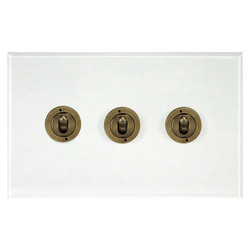 Prism Dolly Switch 3 gang 20 amp 2 way Antique Brass / Clear Perspex