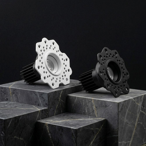 The four Rigel 40 fittings — square fixed, square wall washer, round fixed, round wall washer — on dark marble