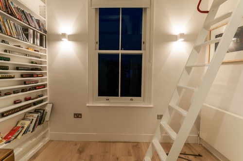 Plaster up and down wall lights in a bedroom