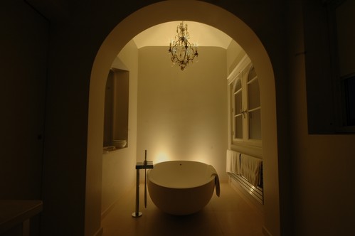 bathroom scenes with uplighters and chandelier