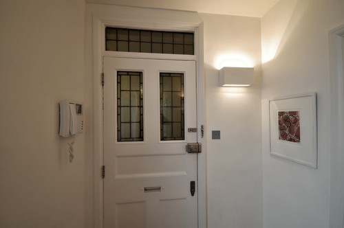 Plaster wall light at entrance