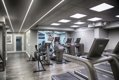 LED panels and LED tape in extrusions in ceiling of gym
