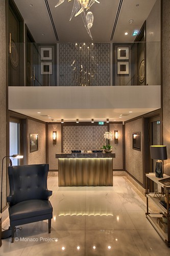Trimless downlights and LED tape lighting reception area