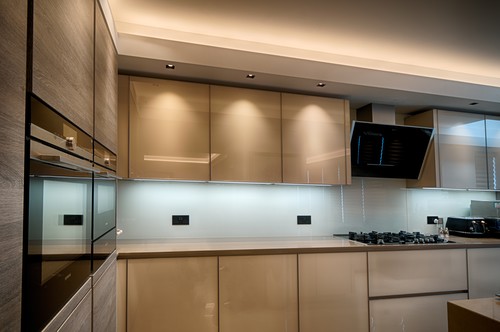 Kitchen cabinets illuminated by trimless downlights