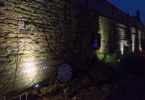 Smooth Spikelights illuminating wall and fence