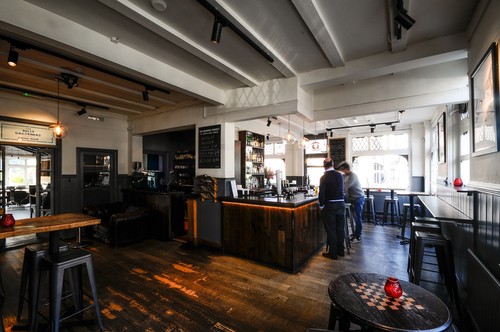 Entrance with track lights and globe pendants, LED Tape under bar counter