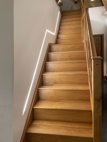 LED Tape and extrusion running up staircase