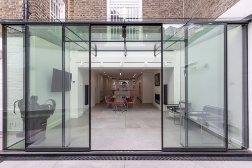 Tube track lighting the glass conservatory