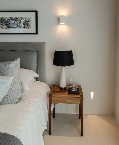 Wall light and low level light on the side of the bed