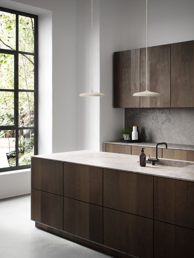 Nordlux Artist pendant lights over a kitchen island