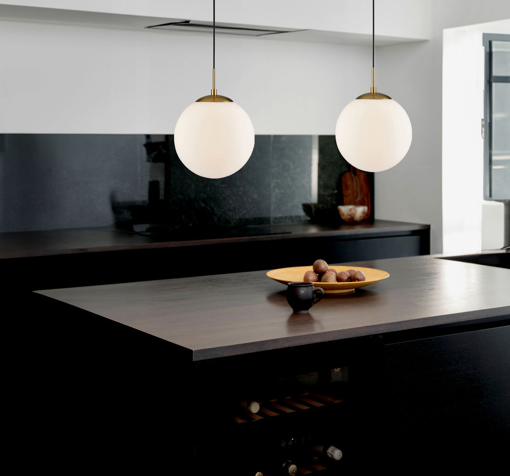 globe pendant lights over a contemporary kitchen island